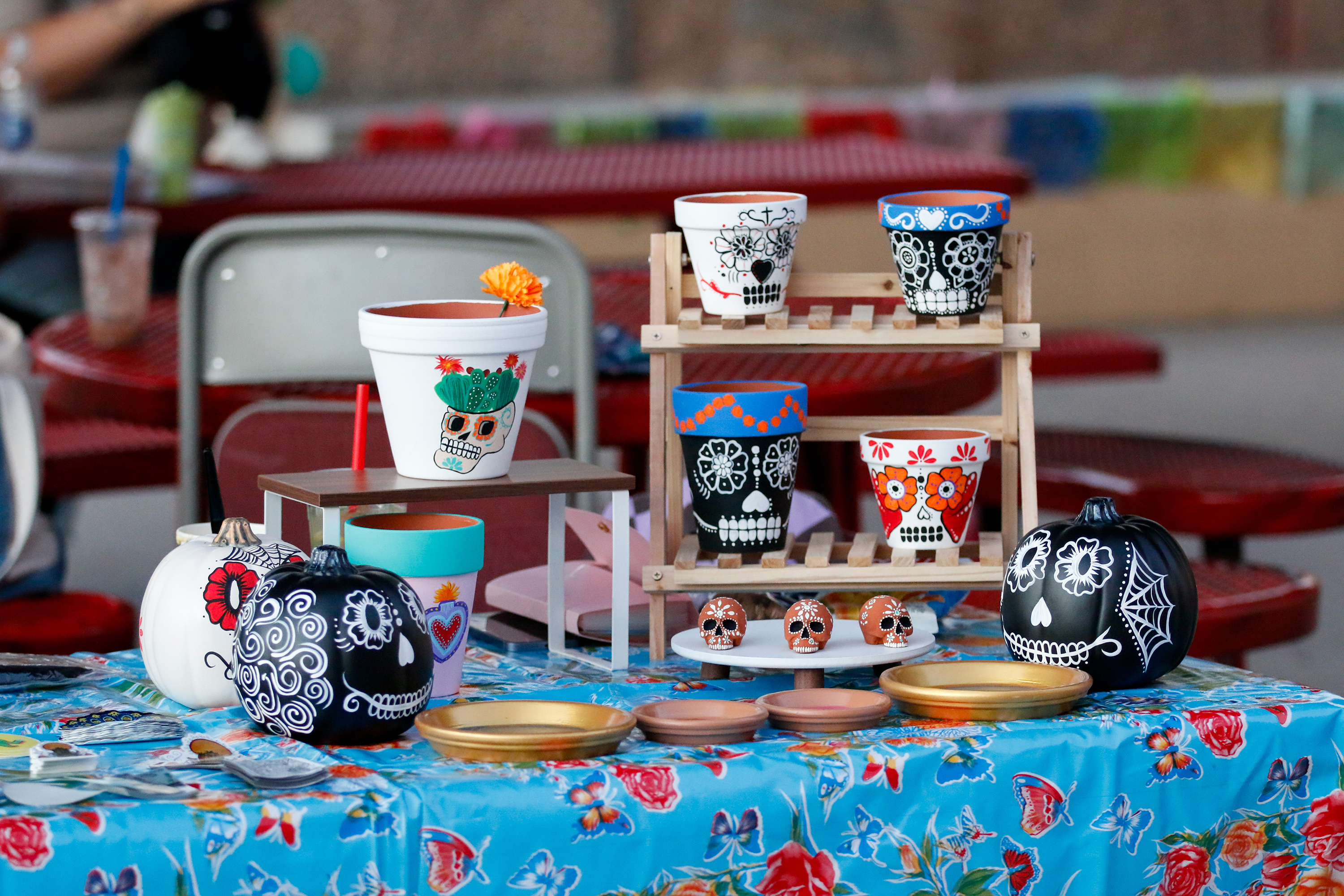 Decorated sugar skulls and pots for sale