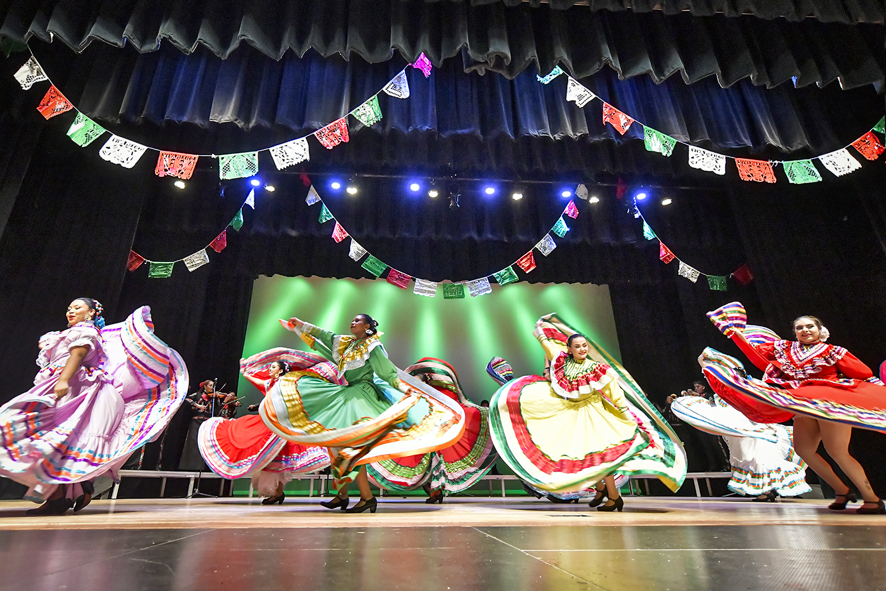 Folklorico dancers perform in their traditional dresses