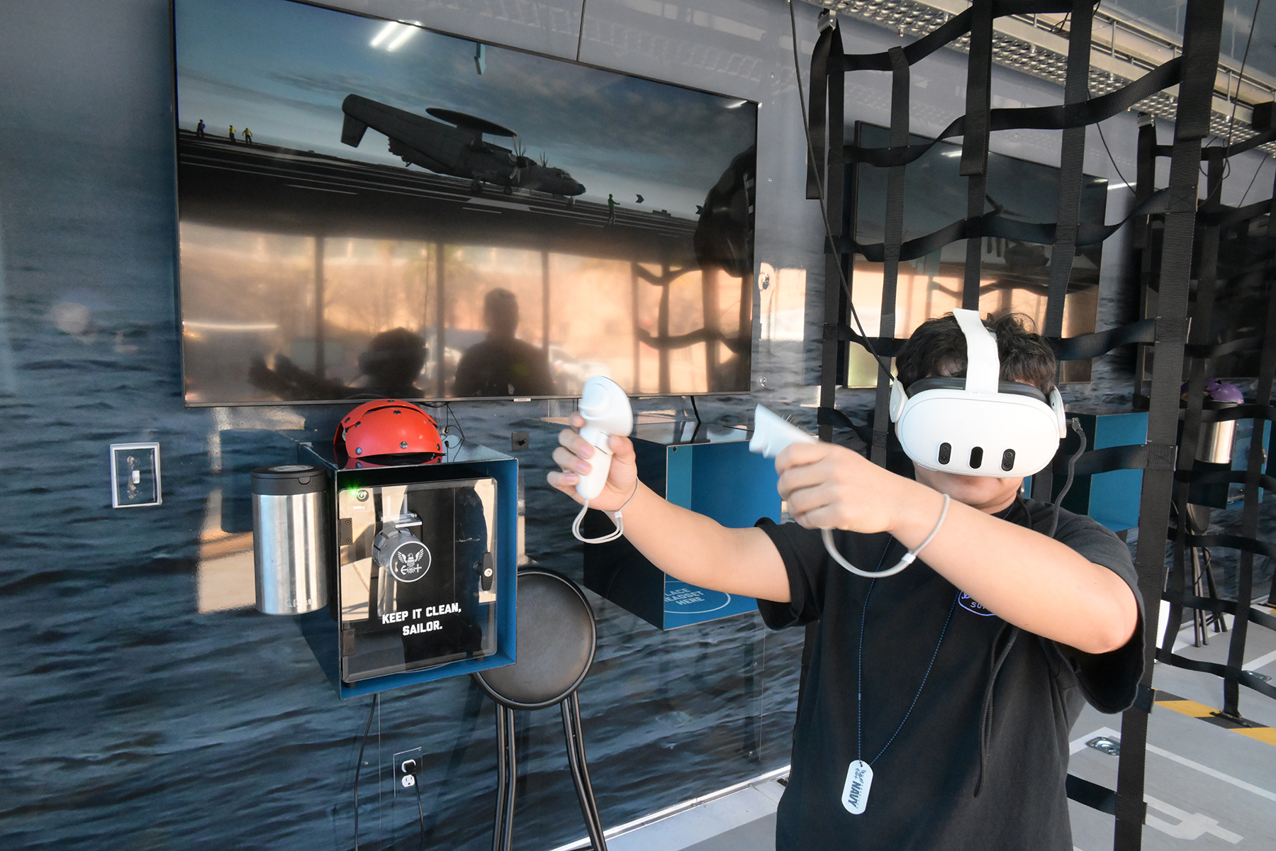 A boy wears a virtual reality headset and takes part in a simulation