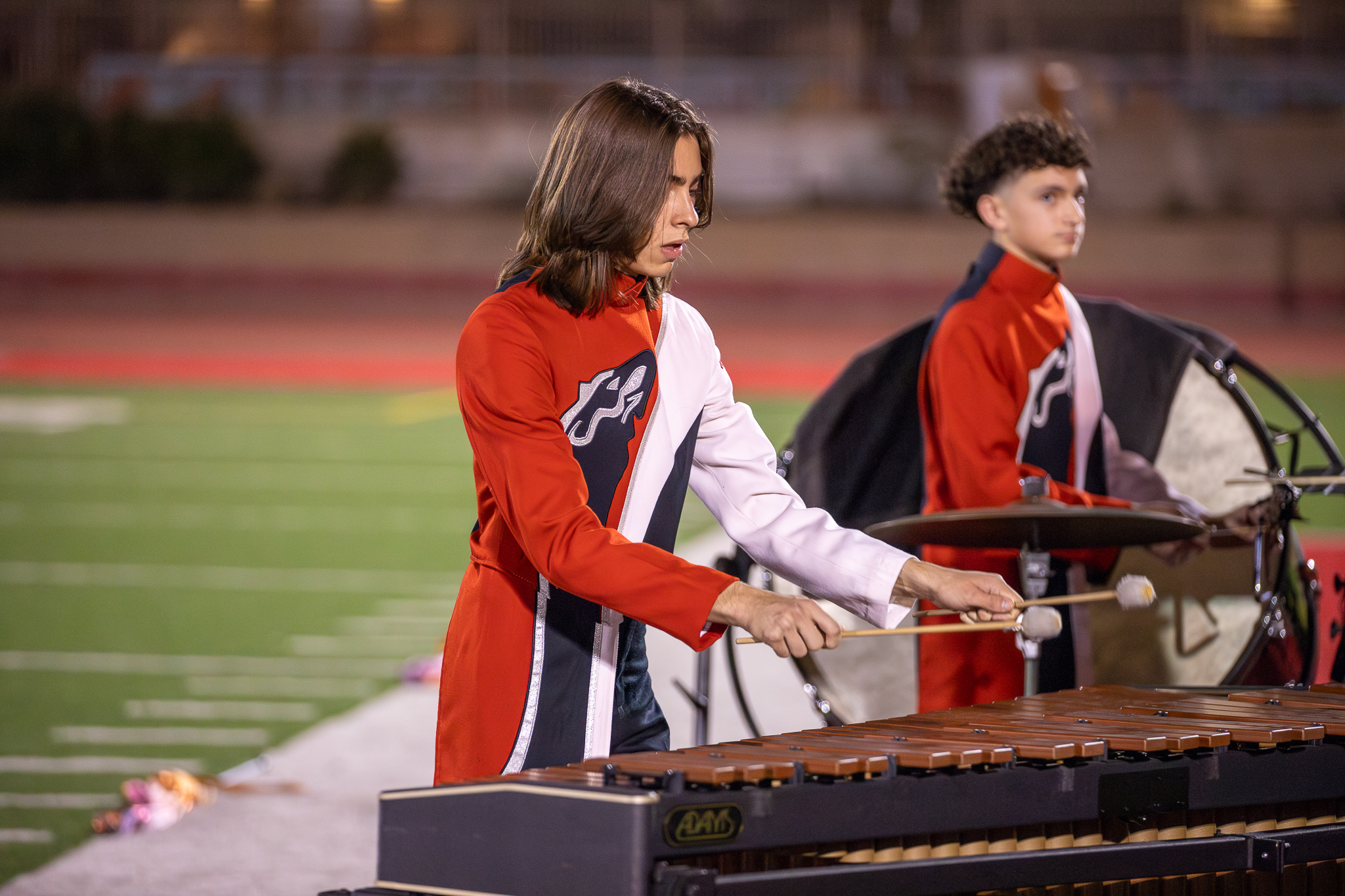 percussion players on the field during the performance