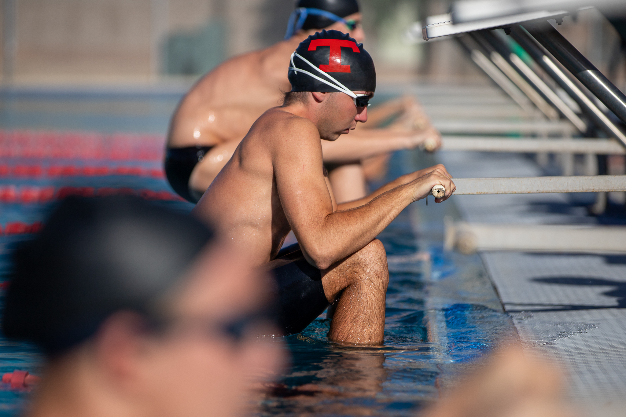 Tucson High swimmers get ready to do the backstroke