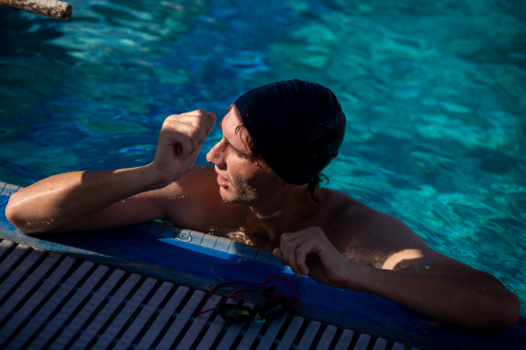 A Tucson High swimmer waits in the pool for his turn to go