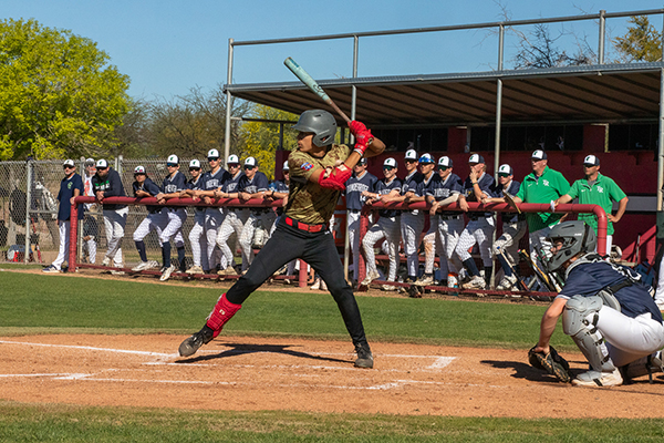 A Tucson High player swings the bat