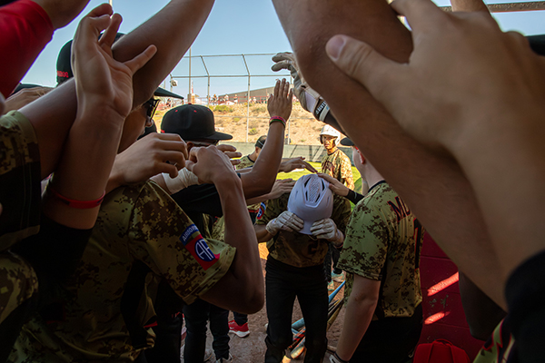 The Tucson High team forms a cheer tunnel