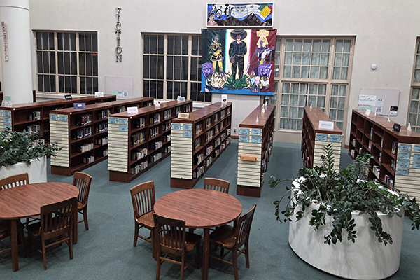 Overlooking the main floor tables and stacks of the fiction section.
