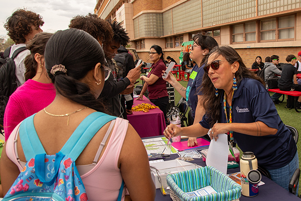 Teens talk to representatives at their table